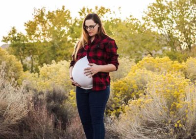 A mom-to-be with Babytree Surrogacy gently holds her belly, showing hope and care for growing a new life.